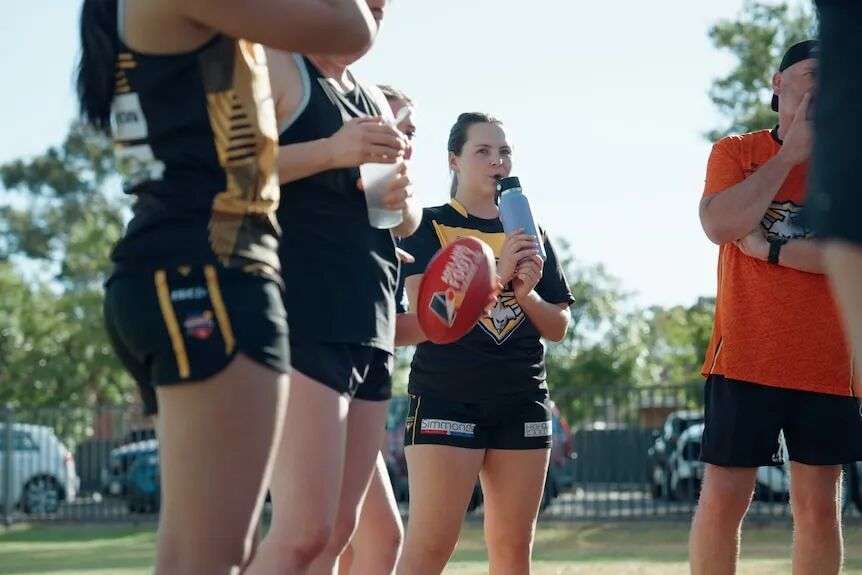 Female footballers at training.