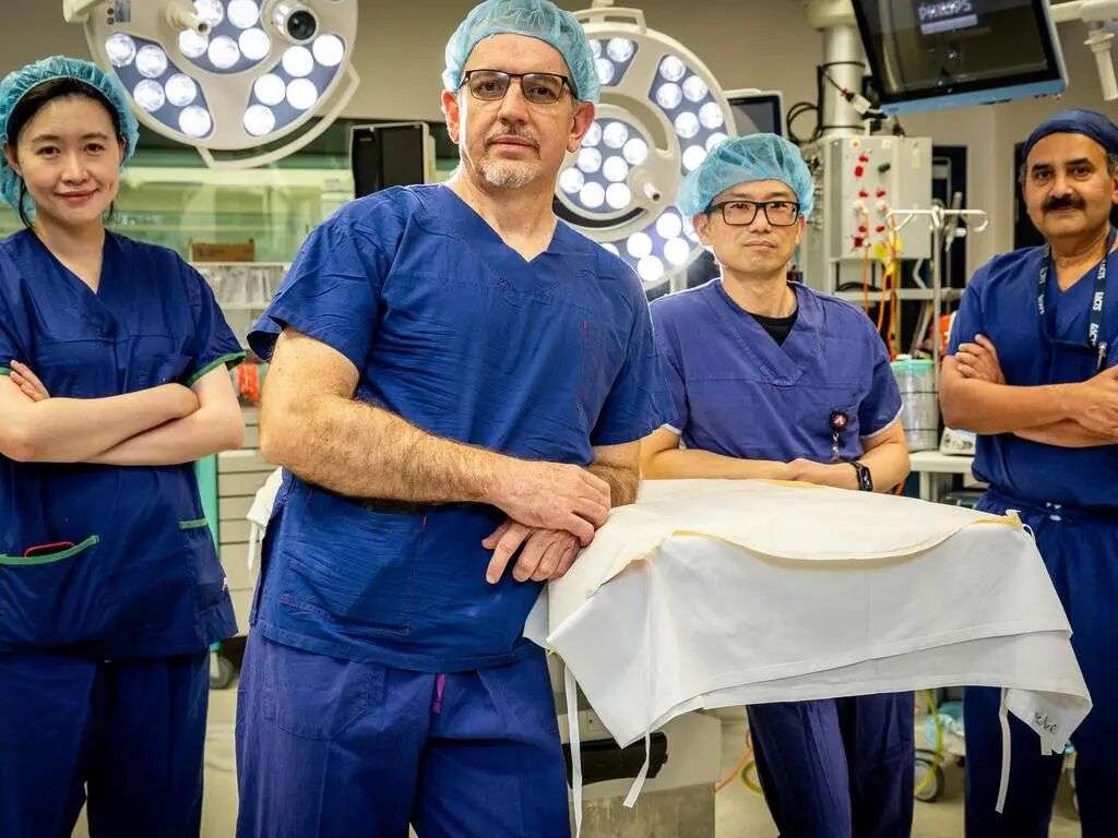 Some of the team who performed an earlier surgery: surgeon Marcos Perini (front) with Dr Sarah Qi, Dr Dixon Woon and Dr Jayapadman Bhaskar at The Austin Hospital. Picture: Jake Nowakowski