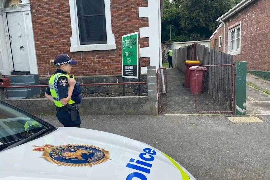 Tasmania Police outside Launceston house where a sudden death is being investigated