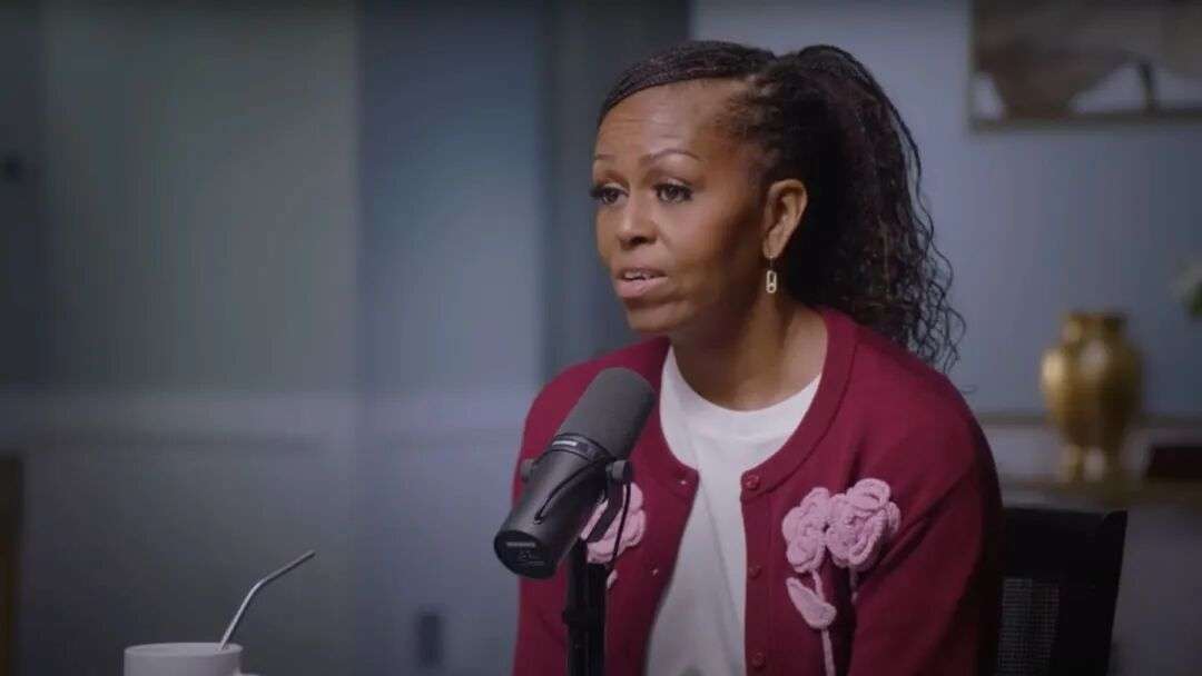 Michelle Obama wears a cardigan by Auckland designer Wynn Hamlyn on her podcast. Photo / YouTube screenshot