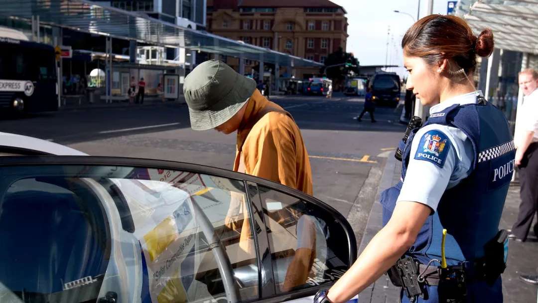 A policewoman removes one of the