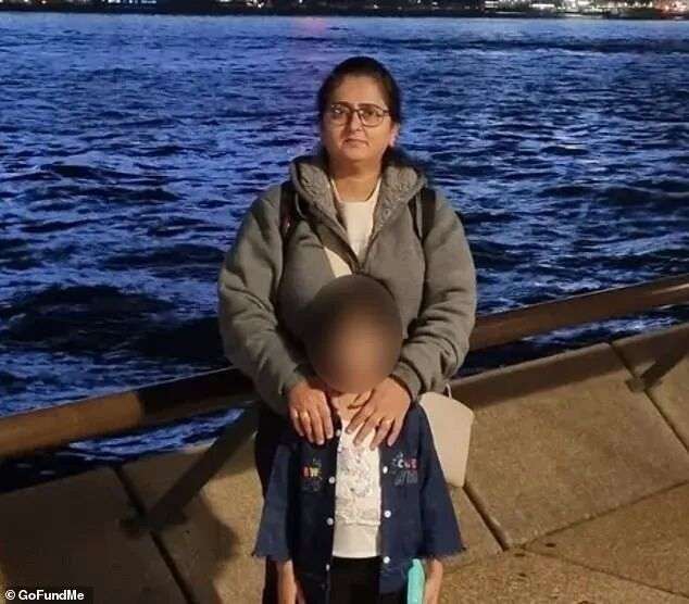 The girl is pictured at Sydney Harbour with her mother, Pritiben