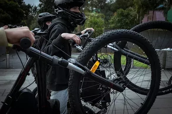 E-bike enthusiasts gather in Melbourne in May. The federal government is vowing a crackdown on illegally modified e-bikes.