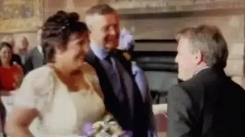 Caravan/Channel5 Paula Leeson in a wedding dress next to Donald McPherson during a wedding ceremony.